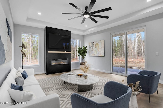 3169 N Gaviidae Dr, Wasilla, AK 99623 - living area with recessed lighting, a raised ceiling, and light wood-style floors