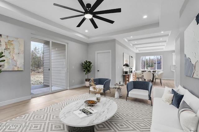 3169 N Gaviidae Dr, Wasilla, AK 99623 - living area featuring ceiling fan, a raised ceiling, light wood-style flooring, recessed lighting, and baseboards