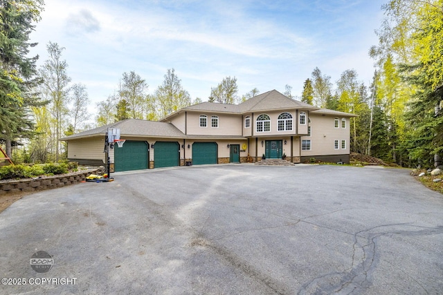 view of front of property with driveway and an attached garage