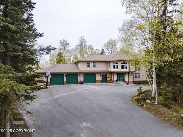 view of front of home featuring an attached garage and driveway