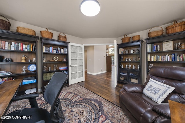 office with wood finished floors, baseboards, and french doors