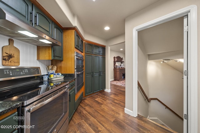 kitchen with stainless steel range with electric stovetop, under cabinet range hood, dark wood-style flooring, baseboards, and recessed lighting