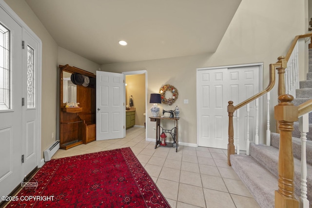entryway featuring a baseboard heating unit, light tile patterned floors, stairs, baseboards, and recessed lighting