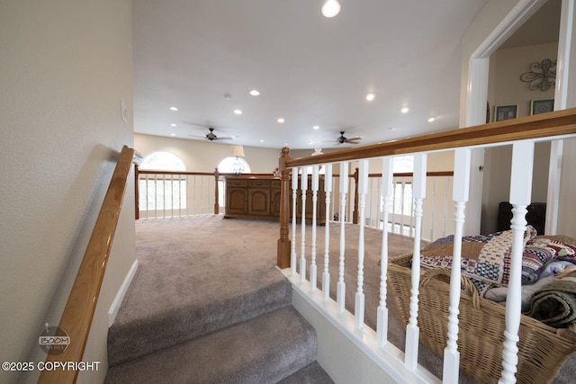 stairs featuring ceiling fan, carpet, recessed lighting, and plenty of natural light