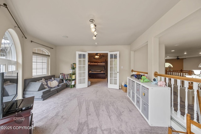 playroom with french doors, carpet flooring, ceiling fan, and track lighting