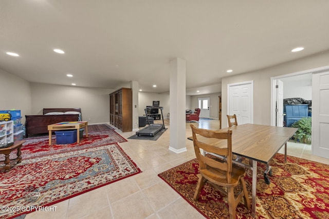 dining space with recessed lighting and light tile patterned floors