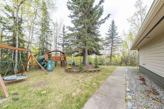 view of grassy yard featuring a playground