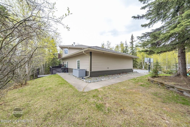 rear view of house with a yard