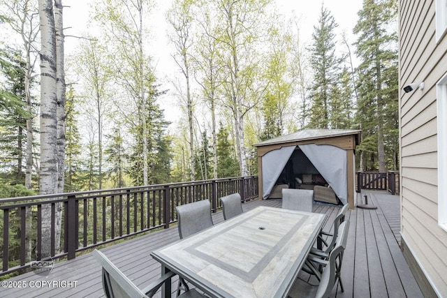 wooden deck with outdoor dining space