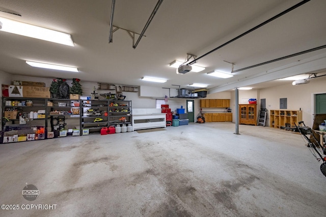 garage featuring a workshop area and a garage door opener