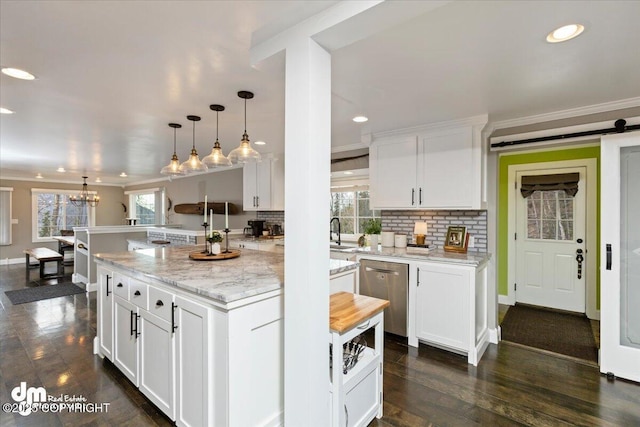 23231 Glacier View Dr, Eagle River, AK 99577 - kitchen featuring a sink, hanging light fixtures, dishwasher, and white cabinets