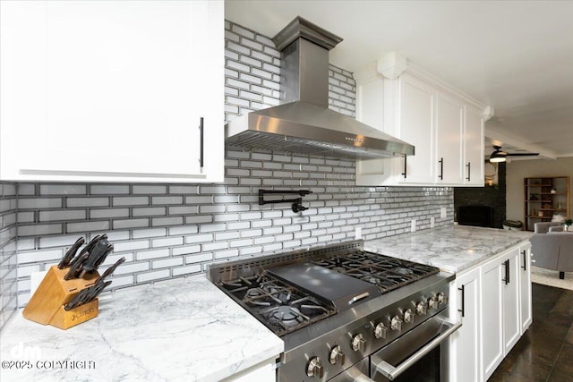 23231 Glacier View Dr, Eagle River, AK 99577 - kitchen with wall chimney range hood, light stone counters, backsplash, and high end stainless steel range