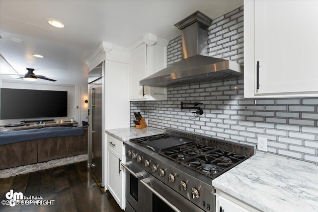 23231 Glacier View Dr, Eagle River, AK 99577 - kitchen featuring high end range, dark wood-style flooring, wall chimney exhaust hood, light stone counters, and open floor plan