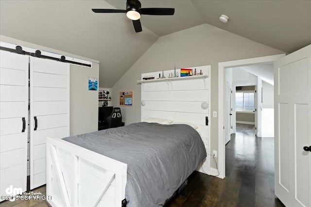 23231 Glacier View Dr, Eagle River, AK 99577 - bedroom with dark wood-type flooring, a barn door, a ceiling fan, and lofted ceiling