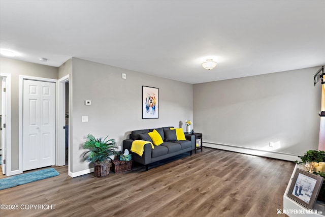 4530 Wright St # 15, Anchorage, AK 99507 - living room featuring baseboards, a barn door, wood finished floors, and baseboard heating