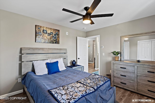 4530 Wright St # 15, Anchorage, AK 99507 - bedroom with baseboards, ceiling fan, and dark wood-style flooring