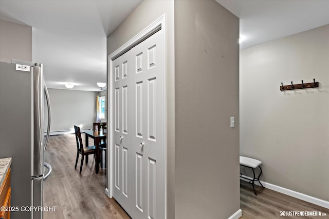 4530 Wright St # 15, Anchorage, AK 99507 - hallway with baseboards and wood finished floors