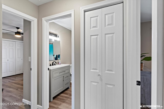 4530 Wright St # 15, Anchorage, AK 99507 - hall with a sink and wood finished floors