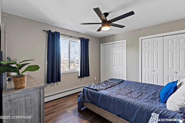 4530 Wright St # 15, Anchorage, AK 99507 - bedroom with a ceiling fan, multiple closets, a baseboard heating unit, and dark wood finished floors