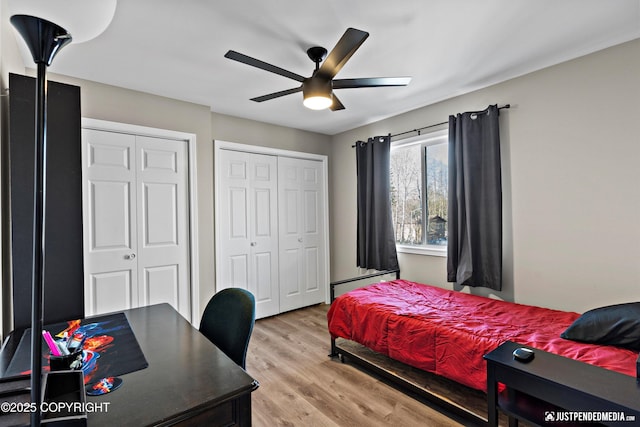 4530 Wright St # 15, Anchorage, AK 99507 - bedroom with light wood-style floors, a baseboard radiator, a ceiling fan, and two closets