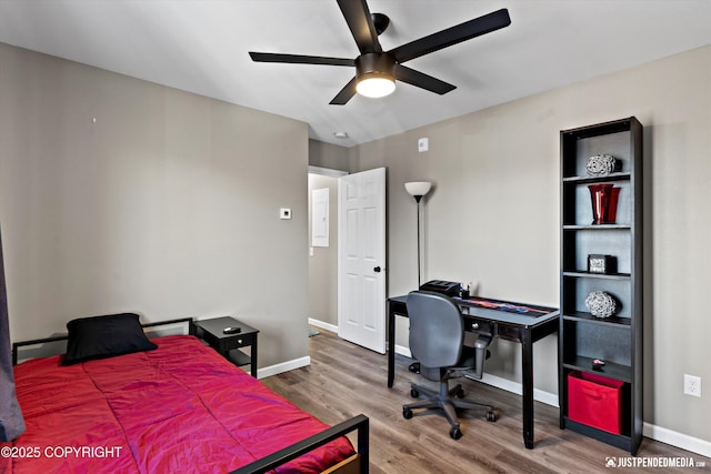 4530 Wright St # 15, Anchorage, AK 99507 - bedroom with baseboards, a ceiling fan, and wood finished floors