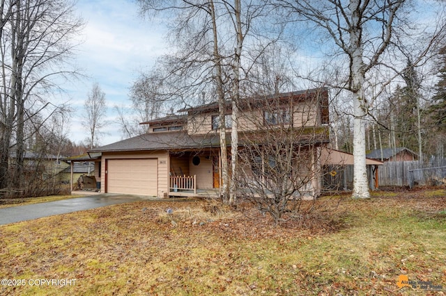 view of front of property with a porch, a garage, fence, and aphalt driveway