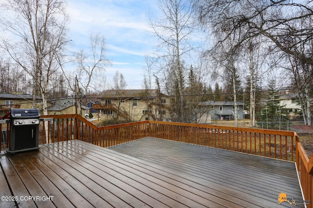 deck featuring grilling area and a residential view