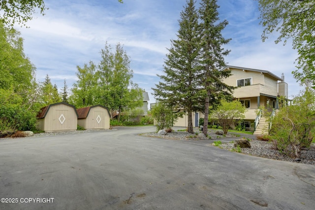 13120 Saunders Rd, Anchorage, AK 99516 - view of property exterior featuring stairs