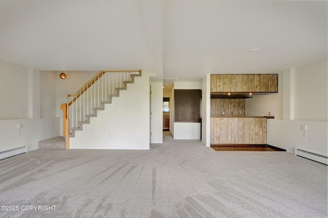 13120 Saunders Rd, Anchorage, AK 99516 - unfurnished living room with stairs, carpet floors, bar area, and a baseboard heating unit