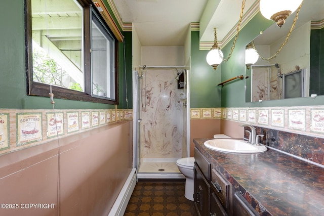 13120 Saunders Rd, Anchorage, AK 99516 - bathroom with vanity, a shower stall, toilet, and a baseboard heating unit