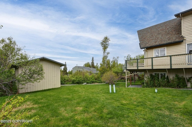 13120 Saunders Rd, Anchorage, AK 99516 - view of green lawn with a wooden deck and an outdoor structure