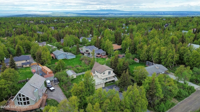 13120 Saunders Rd, Anchorage, AK 99516 - aerial overview of property's location featuring a heavily wooded area and nearby suburban area