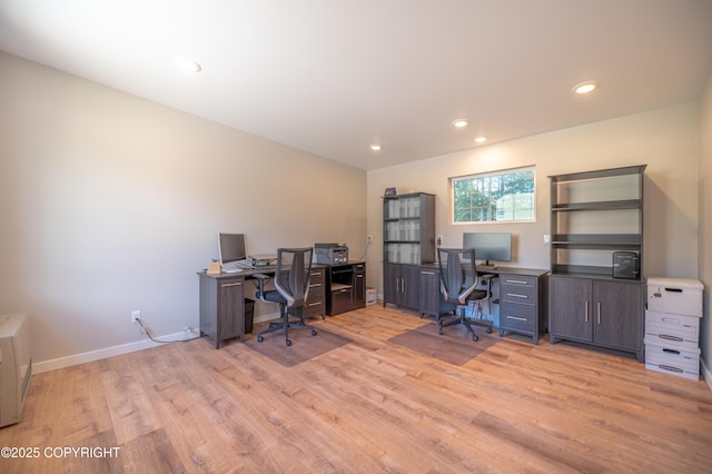 office with light wood finished floors, recessed lighting, and baseboards