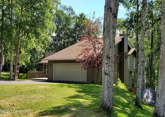 19532 Ostovia Cir, Eagle River, AK 99577 - view of front of property with a front yard, an attached garage, driveway, and a chimney