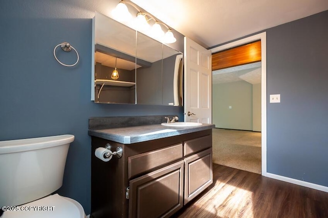 19532 Ostovia Cir, Eagle River, AK 99577 - half bath with toilet, wood finished floors, vanity, and baseboards