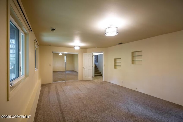 19532 Ostovia Cir, Eagle River, AK 99577 - carpeted spare room with visible vents and stairs