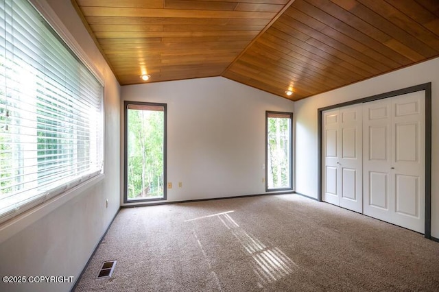 19532 Ostovia Cir, Eagle River, AK 99577 - unfurnished bedroom featuring wood ceiling, vaulted ceiling, visible vents, and carpet floors