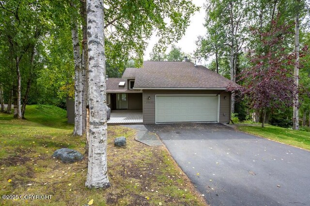 19532 Ostovia Cir, Eagle River, AK 99577 - view of front of home featuring aphalt driveway, roof with shingles, an attached garage, and a front yard