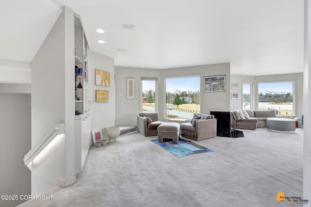 living room featuring carpet and recessed lighting