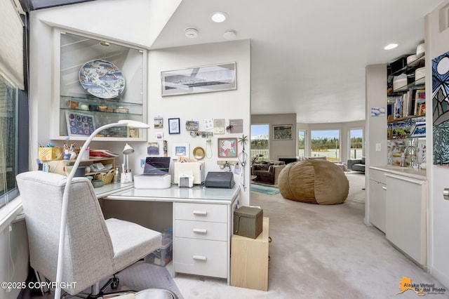 home office with recessed lighting and light carpet