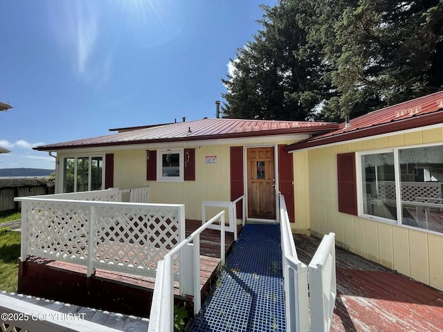 1221 W Kouskov St, Kodiak, AK 99615 - view of front facade with a wooden deck and a metal roof
