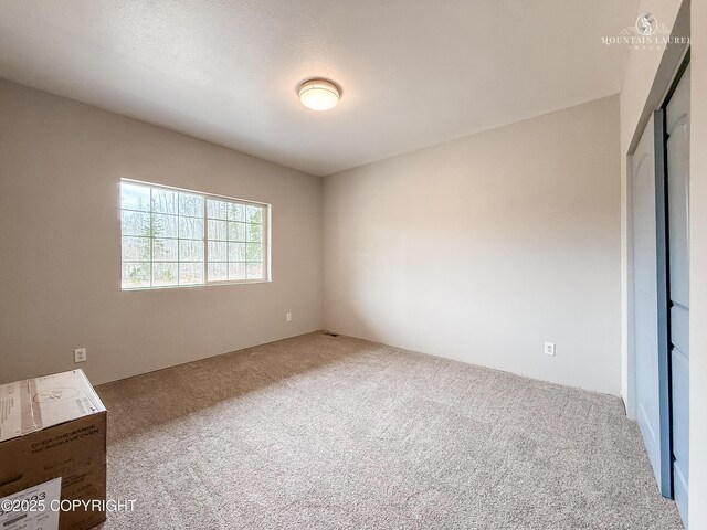 1340 N Rainbow Park Dr, Wasilla, AK 99623 - unfurnished bedroom with carpet