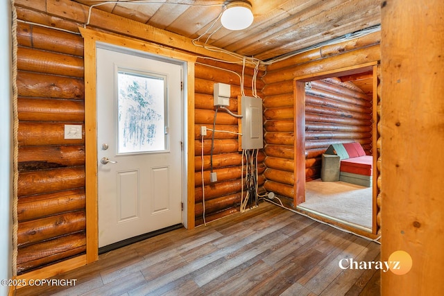 interior space featuring wooden ceiling, electric panel, and hardwood / wood-style flooring