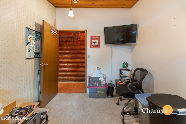 interior space with wooden ceiling, carpet, wallpapered walls, and rustic walls