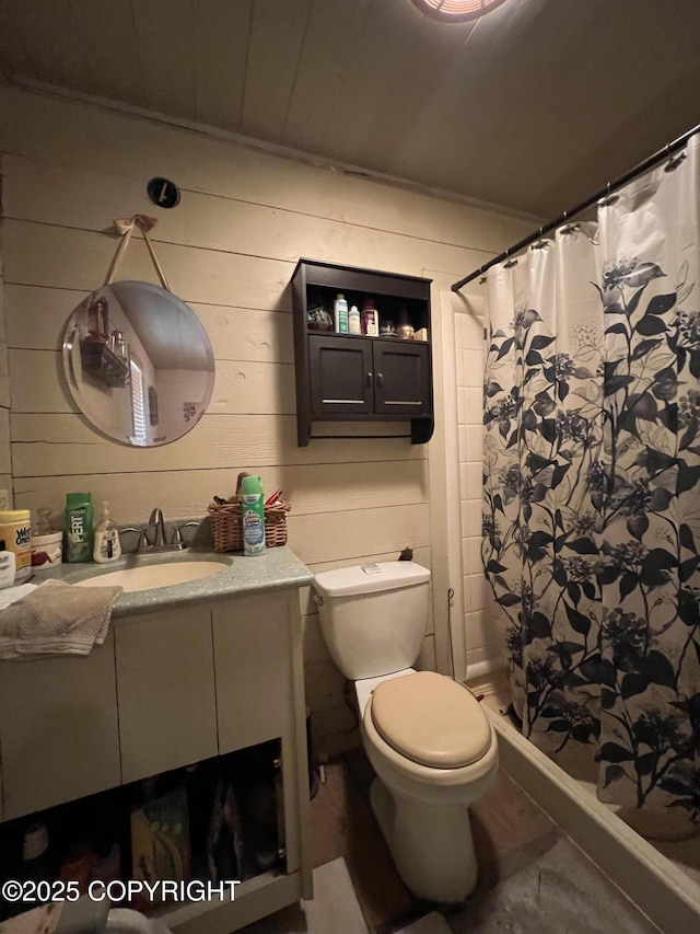 30258 Hook Ln, Soldotna, AK 99669 - bathroom featuring vanity, a shower with shower curtain, and wood walls