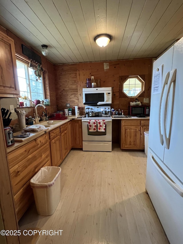 30258 Hook Ln, Soldotna, AK 99669 - kitchen featuring white appliances, plenty of natural light, light wood-style floors, wood walls, and wooden ceiling