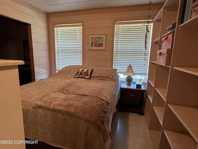 30258 Hook Ln, Soldotna, AK 99669 - bedroom featuring wooden walls and wood finished floors