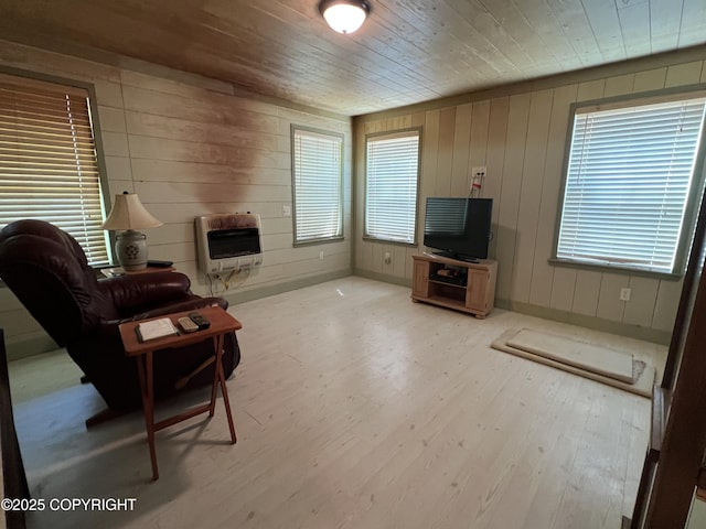 30258 Hook Ln, Soldotna, AK 99669 - living room with heating unit, wood finished floors, wooden ceiling, and wood walls