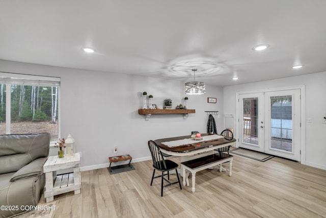 dining room featuring recessed lighting, baseboards, french doors, and light wood-style flooring