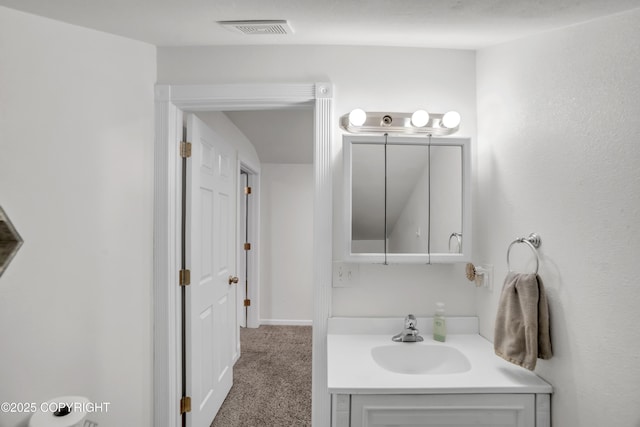 bathroom with visible vents and vanity